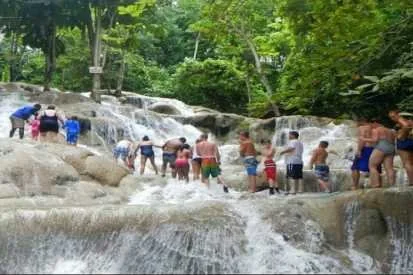 Visitors climbing Dunn's River Falls together