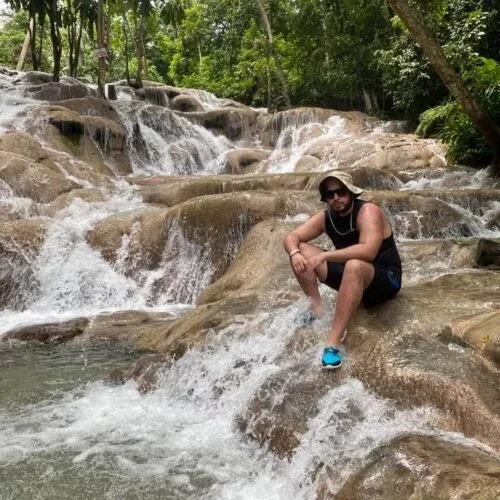 Guest seated in the cascades at Dunn's River Falls