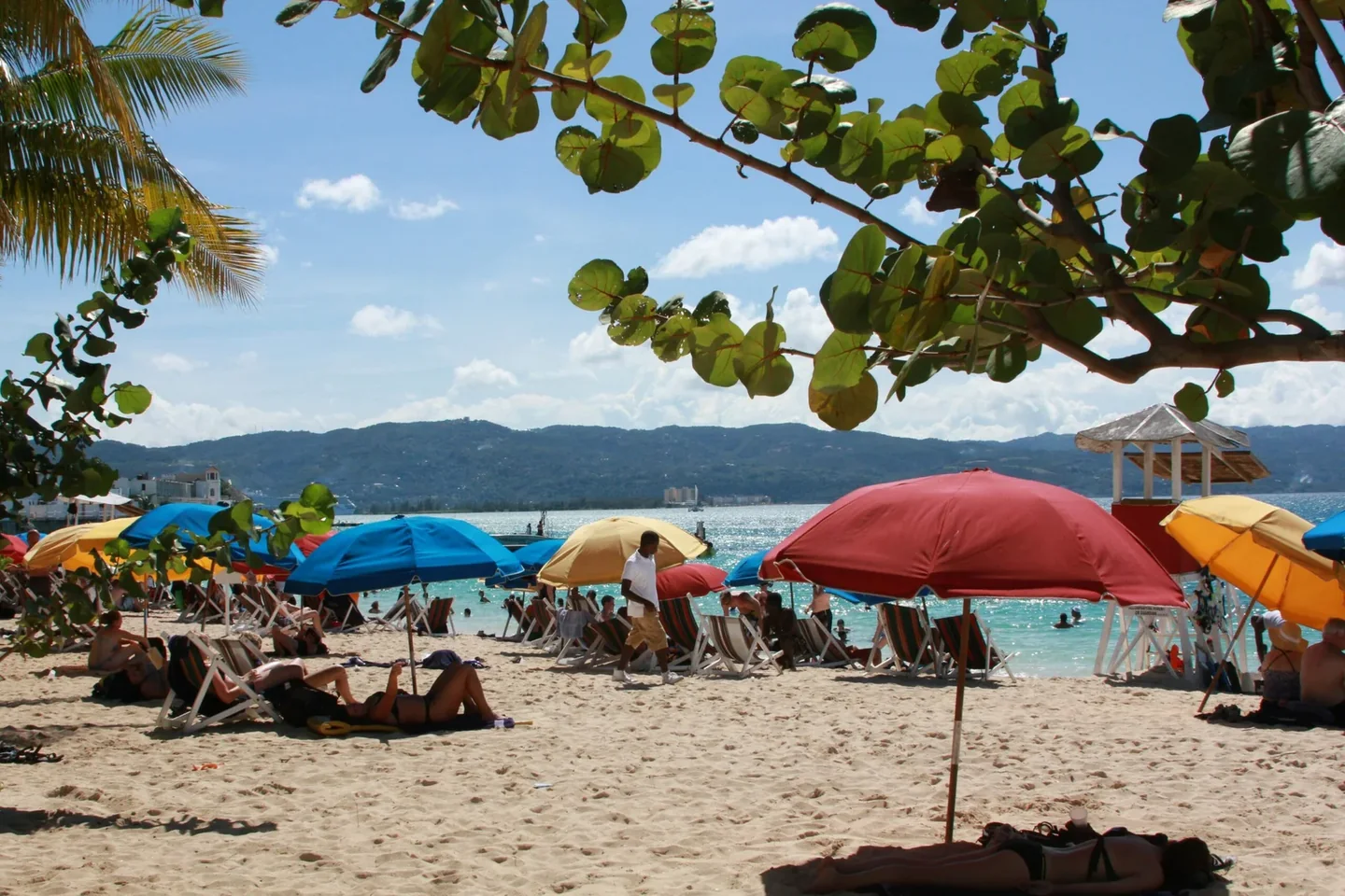 Beach umbrellas and Caribbean water in Montego Bay