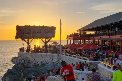 Sunset crowd and cliffside venue at Rick's Cafe Negril