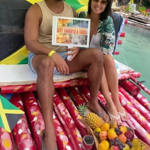 Guests on a colorful bamboo raft in Jamaica